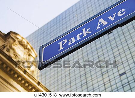 Stock Photo - USA, New York State, New York City, Park Avenue road sign with Grand Central Station in background. Fotosearch