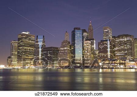 Stock Photo - USA, New York State, New York City, City skyline at dusk. Fotosearch