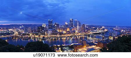 Stock Image - USA, Pennsylvania, Pittsburgh, Skyline at dusk. Fotosearch