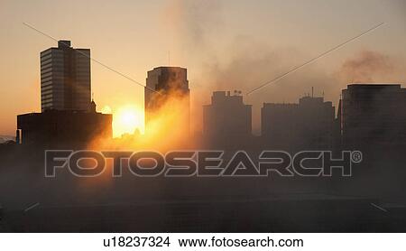 Picture - USA, Tennessee, Knoxville, Early morning fog covering city skyline. Fotosearch