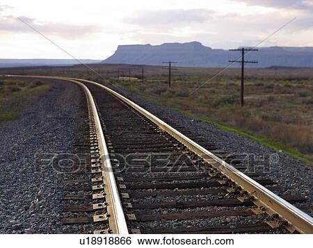 Stock Photograph - USA, Utah, Desert landscape with railroad track. Fotosearch