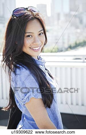 USA, Washington, Seattle, Portrait of young woman outdoors View Large Photo Image Stock Image - USA, Washington, Seattle, Portrait of young woman outdoors. Fotosearch