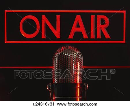Stock Image - Vintage microphone and red on air neon, studio shot. Fotosearch
