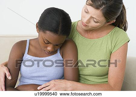 Woman consoling sad girl (10-11) View Large Photo Image Stock Image - Woman consoling sad girl (10-11). Fotosearch