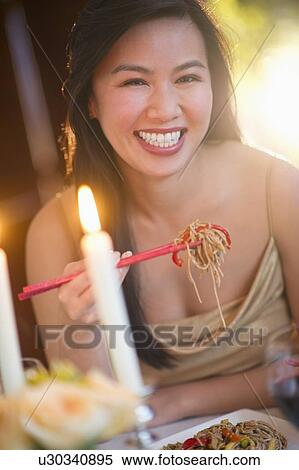 Woman enjoying fine meal in restaurant View Large Photo Image Stock Photography - Woman enjoying fine meal in restaurant. Fotosearch