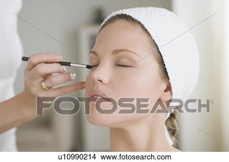Woman having make-up applied View Large Photo Image Picture - Woman having make-up applied. Fotosearch