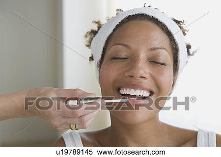 Woman having make-up applied View Large Photo Image Stock Photography - Woman having make-up applied. Fotosearch