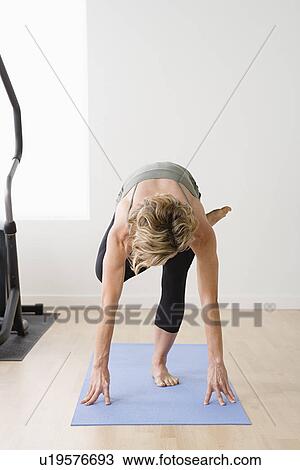 Stock Image - Woman in yoga pose. Fotosearch