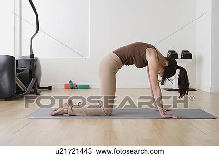 Woman in yoga pose View Large Photo Image Stock Image - Woman in yoga pose. Fotosearch