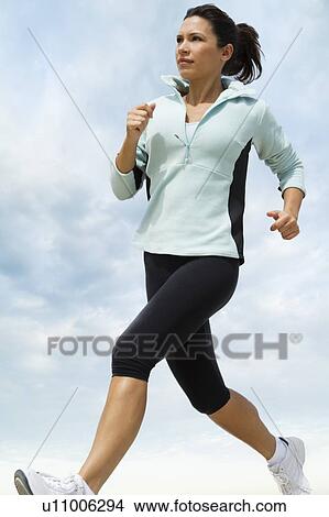 Woman jogging View Large Photo Image Picture - Woman jogging. Fotosearch