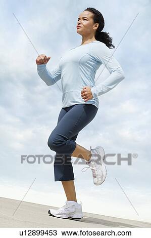 Woman jogging View Large Photo Image Stock Image - Woman jogging. Fotosearch