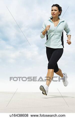 Stock Photo - Woman jogging. Fotosearch