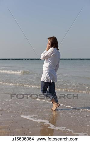 Picture - Woman on beach. Fotosearch