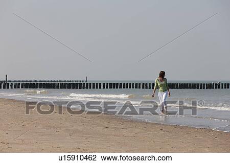Woman on beach View Large Photo Image Stock Image - Woman on beach. Fotosearch