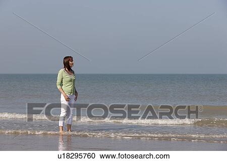 Woman on beach View Large Photo Image Stock Image - Woman on beach. Fotosearch