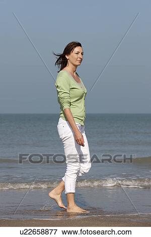 Woman on beach View Large Photo Image Stock Photo - Woman on beach. Fotosearch
