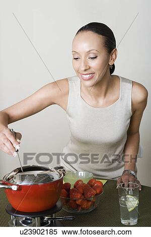 Woman preparing dessert View Large Photo Image Stock Photography - Woman preparing dessert. Fotosearch