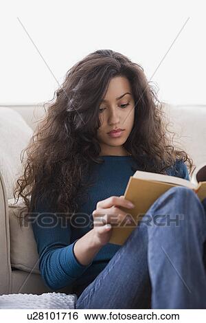 Woman reading book at home View Large Photo Image Stock Photograph - Woman reading book at home. Fotosearch