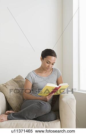 Woman reading book at home View Large Photo Image Stock Photography - Woman reading book at home. Fotosearch