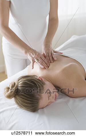 Woman receiving massage View Large Photo Image Stock Image - Woman receiving massage. Fotosearch