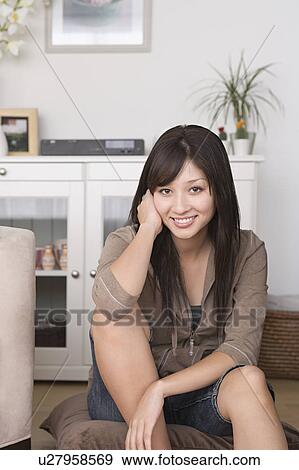 Woman relaxing at home View Large Photo Image Stock Photo - Woman relaxing at home. Fotosearch