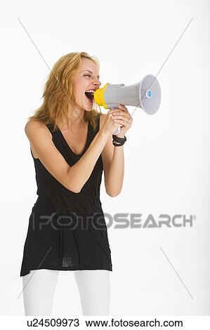 Woman shouting through bullhorn, studio shot View Large Photo Image Stock Image - Woman shouting through bullhorn, studio shot. Fotosearch