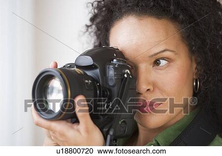Woman taking pictures with digital camera View Large Photo Image Stock Image - Woman taking pictures with digital camera. Fotosearch