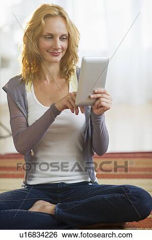 Woman using tablet pc View Large Photo Image Stock Photograph - Woman using tablet pc. Fotosearch
