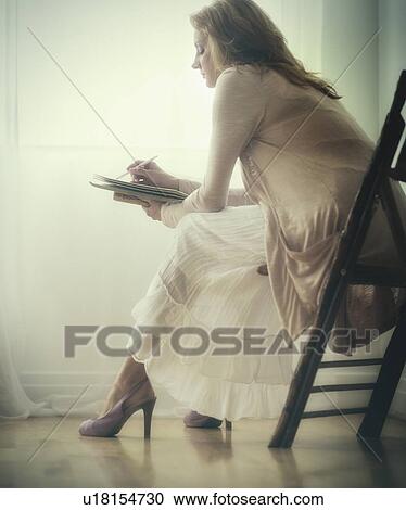 Woman writing journal View Large Photo Image Stock Image - Woman writing journal. Fotosearch