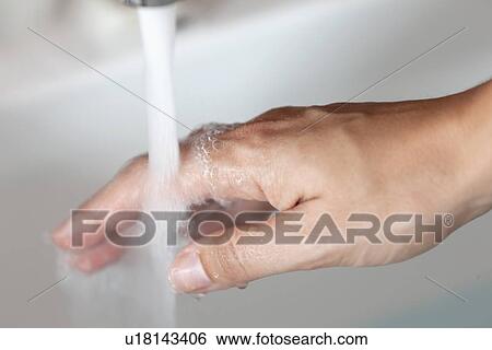 Woman's hand under tap pouring water View Large Photo Image Stock Photograph - Woman's hand under tap pouring water. Fotosearch