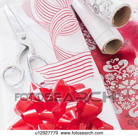 Stock Photo - Wrapping paper, ribbon and scissors. Fotosearch