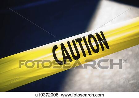 Stock Photograph - Yellow caution tape. Fotosearch