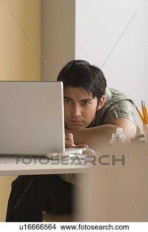 Young businessman at work View Large Photo Image Picture - Young businessman at work. Fotosearch