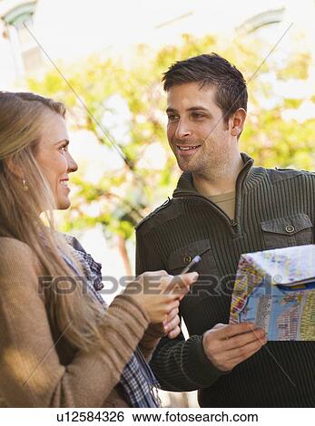 Young couple visiting city View Large Photo Image Stock Photograph - Young couple visiting city. Fotosearch