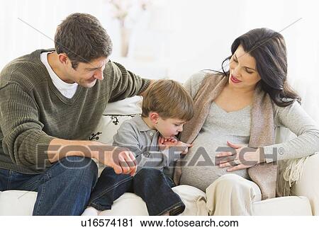 Boy (4-5) touching pregnant mother's belly View Large Photo Image Stock Image - Boy (4-5) touching pregnant mother's belly. Fotosearch