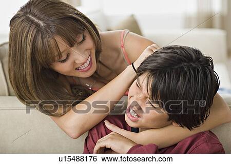 Brother and sister fighting together View Large Photo Image Stock Photograph - Brother and sister fighting together. Fotosearch