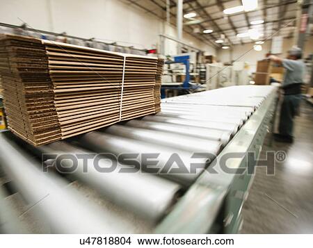 Picture - Bundle on conveyor belt. Fotosearch