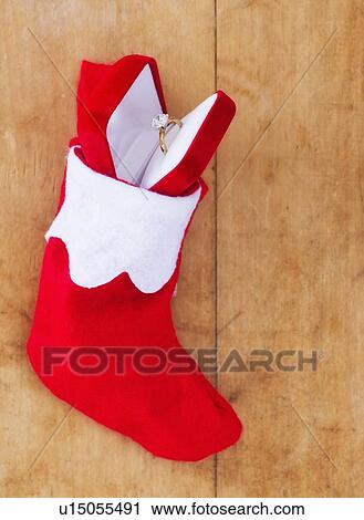 Christmas stocking with engagement ring View Large Photo Image Stock Image - Christmas stocking with engagement ring. Fotosearch