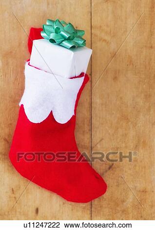 Christmas stocking with small gift View Large Photo Image Stock Image - Christmas stocking with small gift. Fotosearch