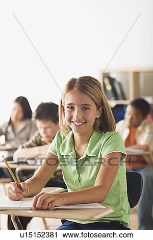 Class writing in their copy books View Large Photo Image Stock Image - Class writing in their copy books. Fotosearch