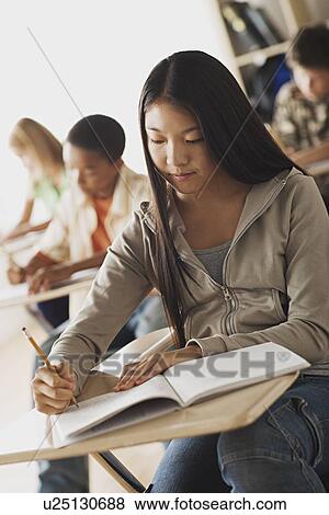 Class writing in their copy books View Large Photo Image Stock Photo - Class writing in their copy books. Fotosearch