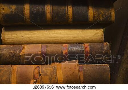 Stock Photograph - Close up of antique books in leather covers, studio shot. Fotosearch