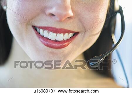 Stock Photo - Close-up of female customer service representative. Fotosearch