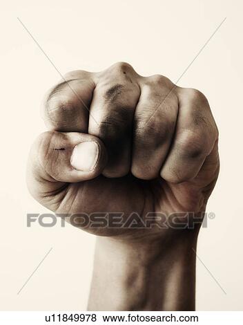 Close-up of fist, studio shot View Large Photo Image Stock Photo - Close-up of fist, studio shot. Fotosearch