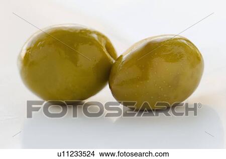 Close-up of green olives, studio shot View Large Photo Image Picture - Close-up of green olives, studio shot. Fotosearch