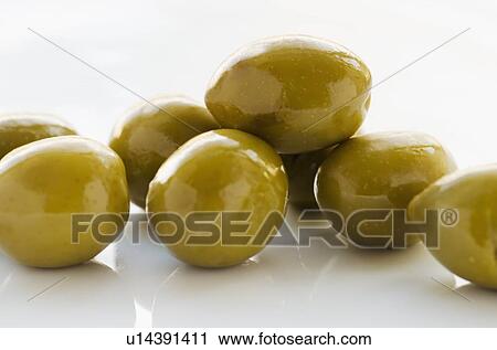 Close-up of green olives, studio shot View Large Photo Image Stock Image - Close-up of green olives, studio shot. Fotosearch