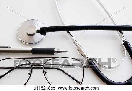 Close up of pen, glasses and calculator and stethoscope, studio shot View Large Photo Image Stock Photography - Close up of pen, glasses and calculator and stethoscope, studio shot. Fotosearch