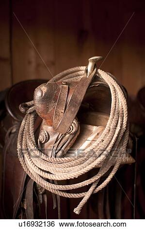 Stock Photograph - Close-up of saddle with rope. Fotosearch