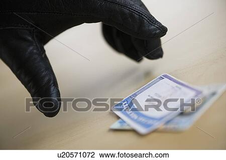 Close up of thief's hand in black glove stealing driver's license, studio shot View Large Photo Image Stock Image - Close up of thief's hand in black glove stealing driver's license, studio shot. Fotosearch