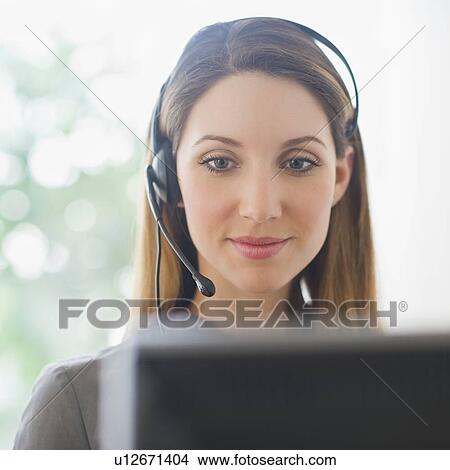 Picture - Close-up of young woman with headphones. Fotosearch